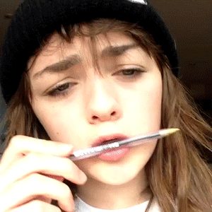 Cutie teen playing with pen