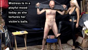 mistress takes pleasure in torturing her slave's balls