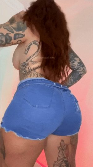 revealing her big tattooed ass