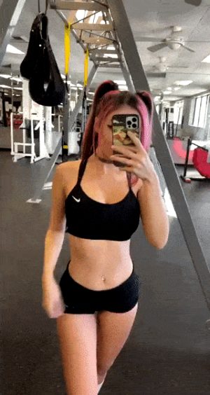 Showing her beautiful tits in a public gym