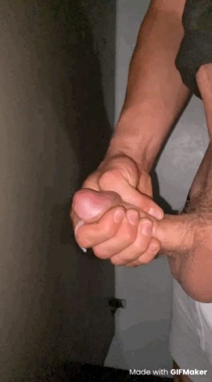 Stroking my dick cumming in a public restroom